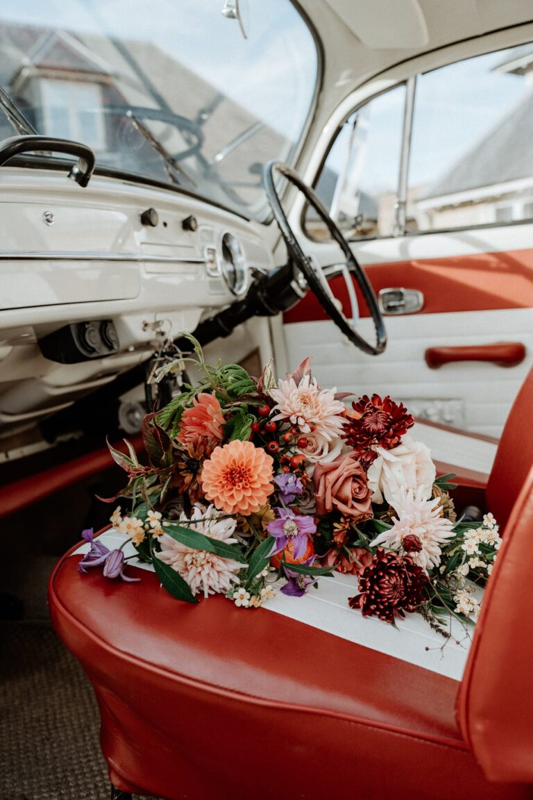 Bridal bouquet on the front seat of VW bug