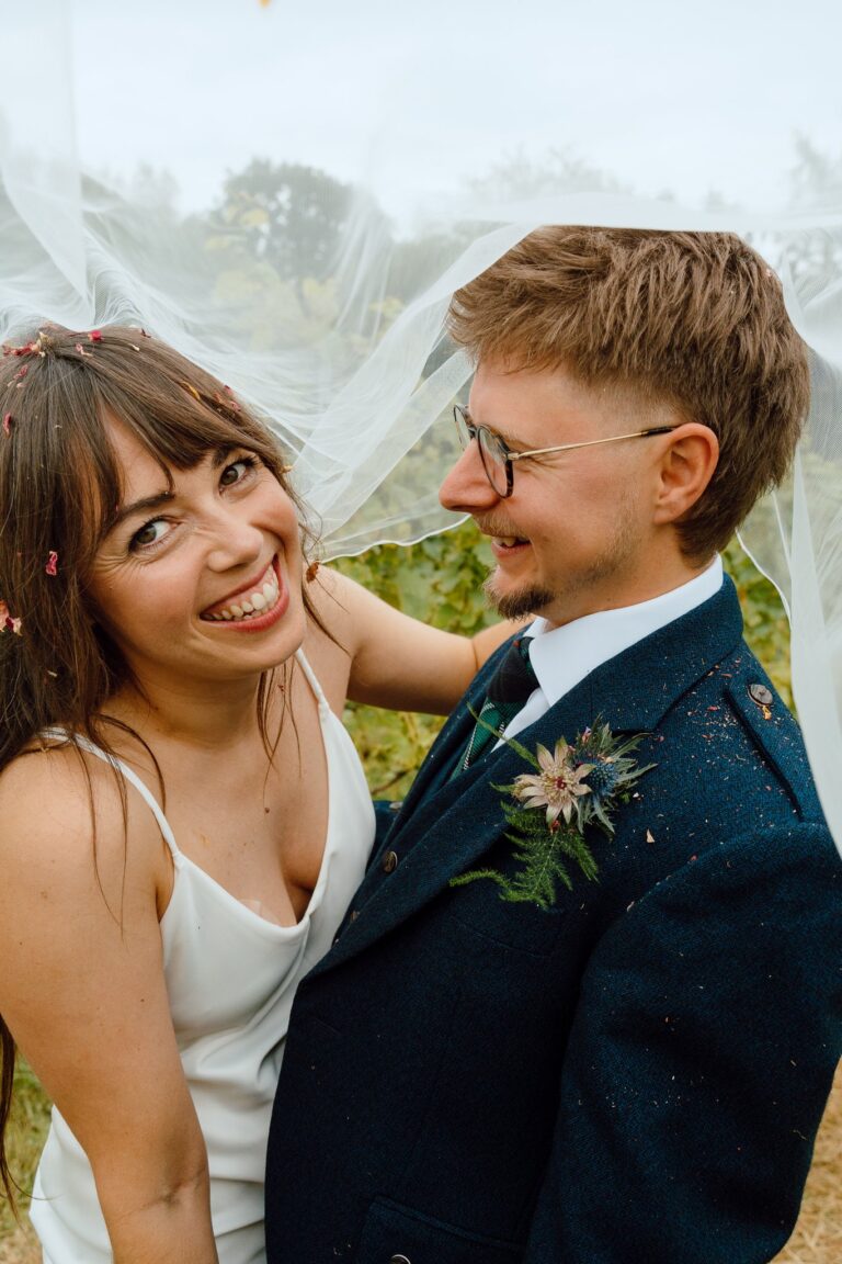 happy bride and groom in portraits at Winklestone Vineyard