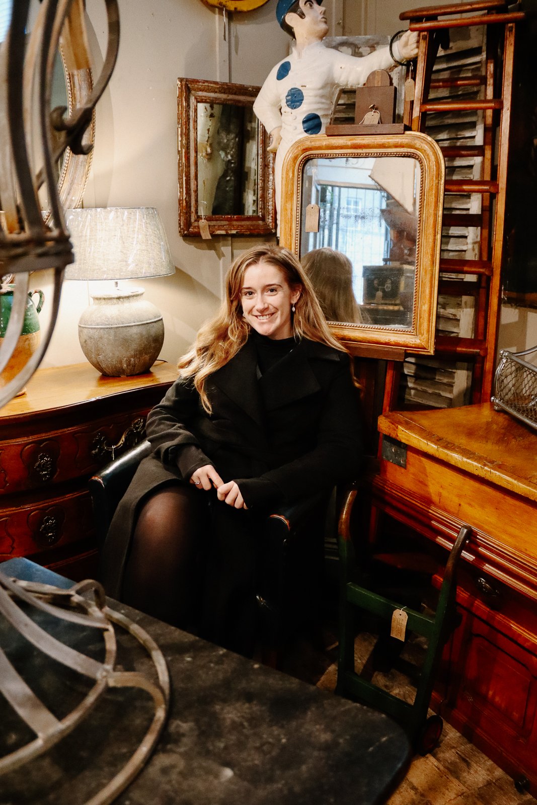 Fran sitting in an antique shop in Arundel, West Sussex