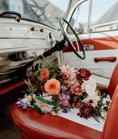 Bridal bouquet on the front seat of VW bug