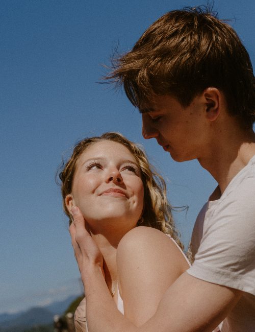 Couples photos - girl looking back at boyfriend in Tofino
