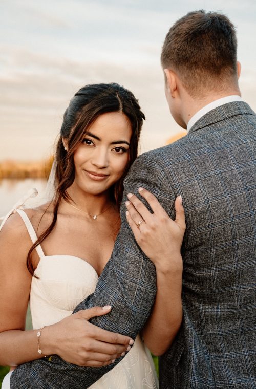 bride and groom portraits lakeside at intimate wedding